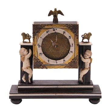 Picture of Table clock made of wood, brass, bone. 20th century.